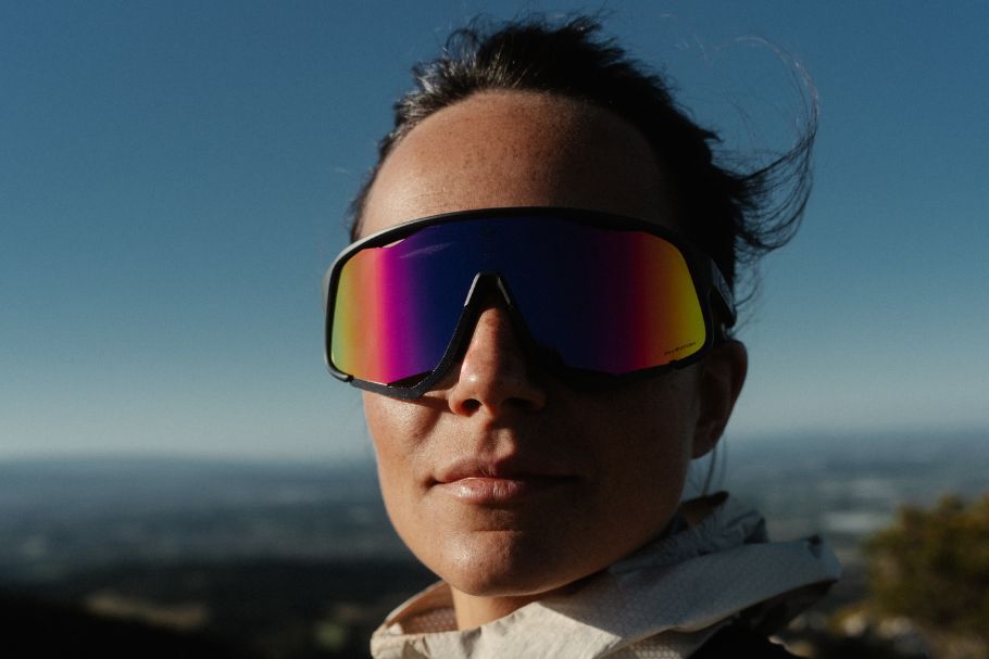 Skier wearing PHANTOM photochromic goggles in mountain environment