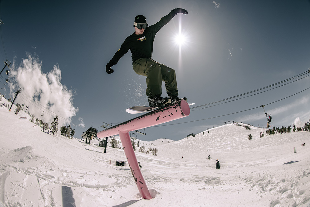 Zak Hale hitting a rail on a snowboard in Park City